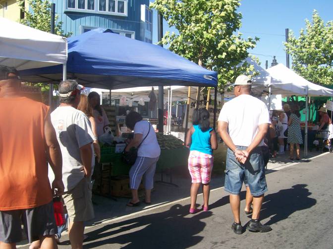 Residents flock to the Farmers Market.