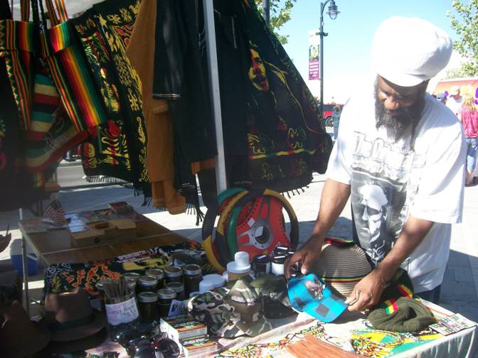 Jah-Fyah, owner of The Mustard Seed Rasta Shop, sells rastarian-inspired merchadise at the Lancaster Farmers Market.