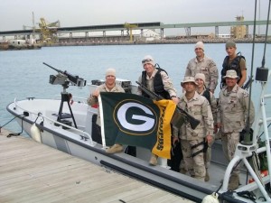 Eric (far left) continued to support of his team while at the Coast Guard Station.