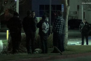 Owner Tully Huffaker and patrons stand outside the club after the shooting.