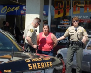 This lady was arrested when authorities searched her name and found a $50,000 narcotics warrant.