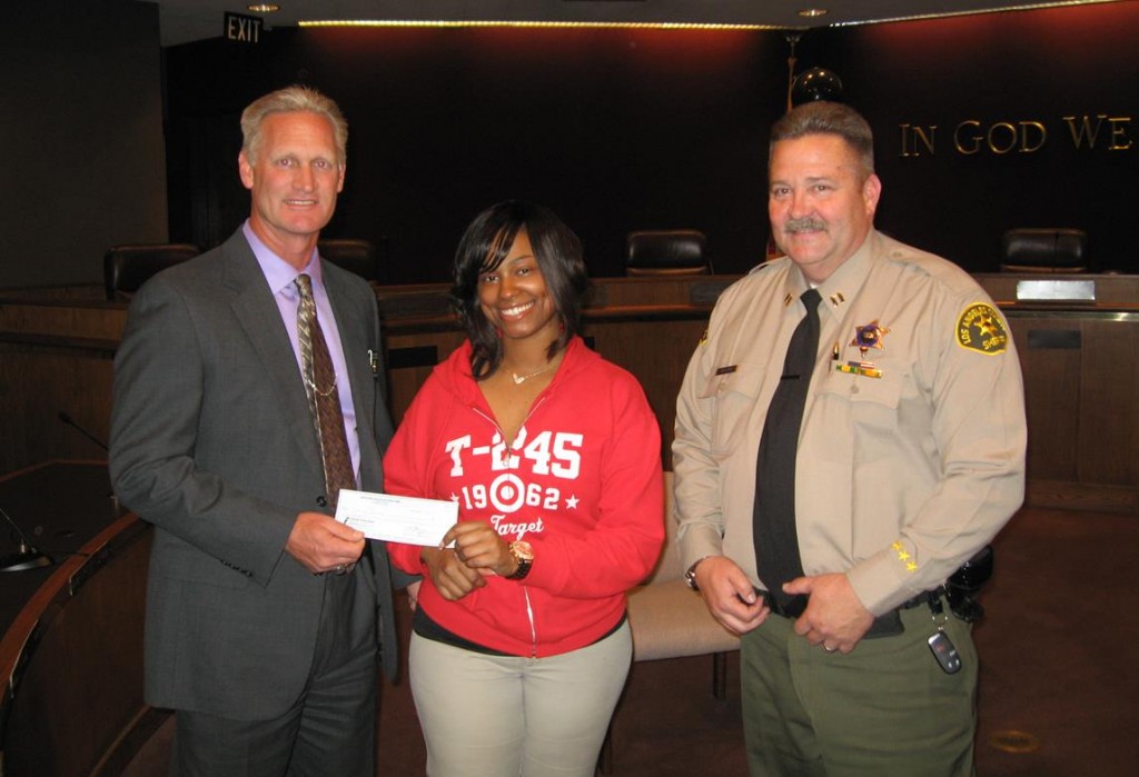 Lancaster Target Manager Skyla Gray (center) presented a $500 check to Lancaster Station Captain Pat Nelson (right) and Lt. Dave Oliva (left) at Lancaster City Hall Thursday afternoon (March 21). 