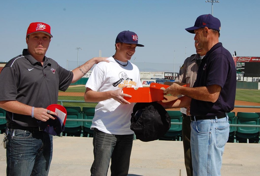 Jonathan is presented with brand new Nike cleats from John Laferney, director of baseball operations for Lancaster JetHawks.